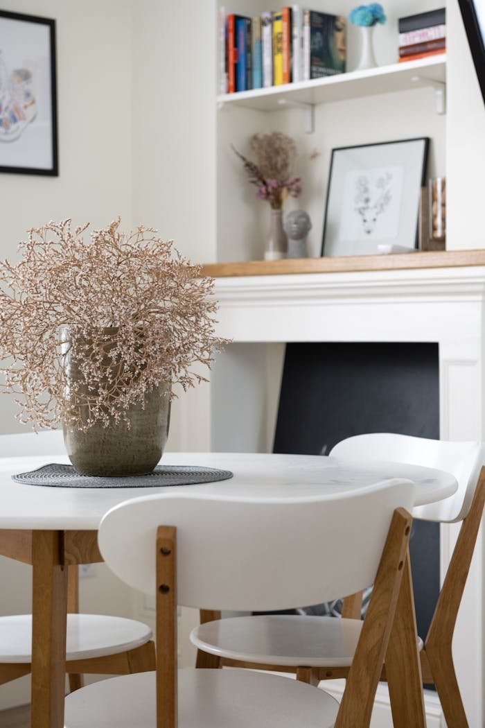 Stylish dining room featuring a minimalistic table setup, elegant decor, and classic furniture.